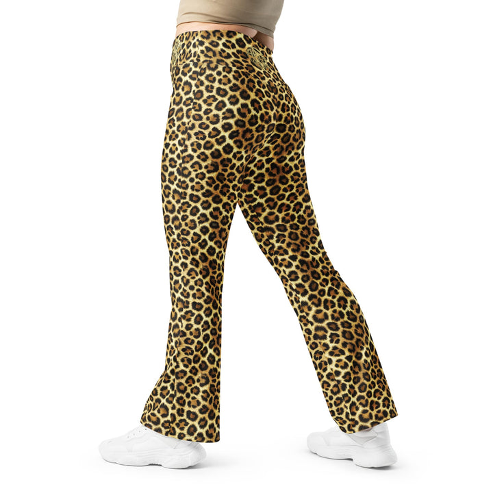 Side view of ARLXUN leopard flare leggings showing flared bottom