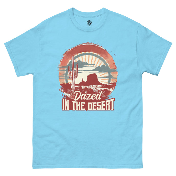 Light blue t-shirt with a desert-themed graphic and text 'Dazed in the Desert' on a white background.