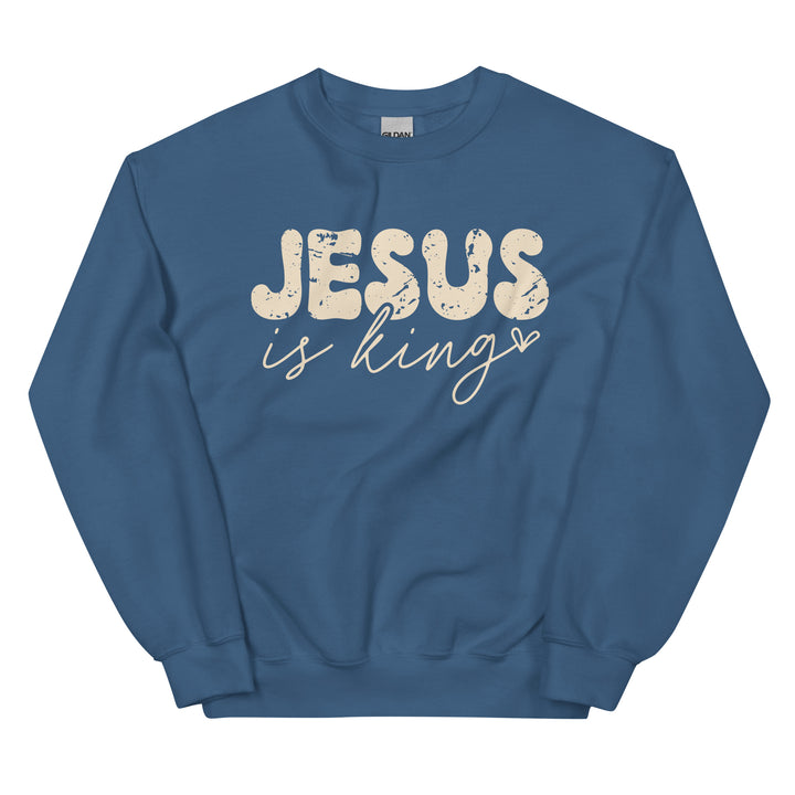 Indigo blue Christian sweatshirt with Jesus Is King text on the front, laid flat on a neutral background.