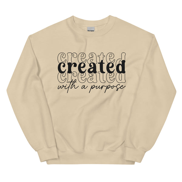 Beige sweatshirt with 'created with a purpose' text on a white background