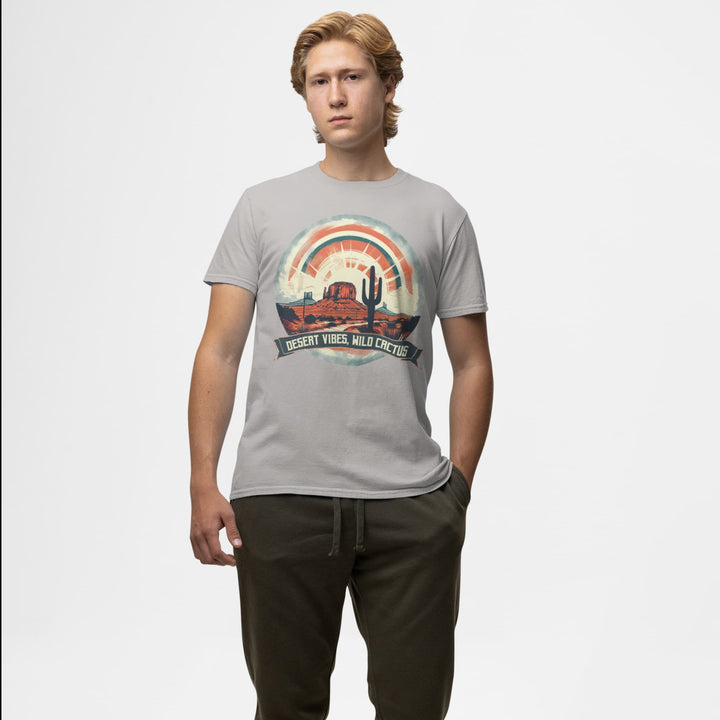 Man wearing a grey Western T-shirt with “Desert Vibes Wild Cactus” desert rainbow cactus graphic.